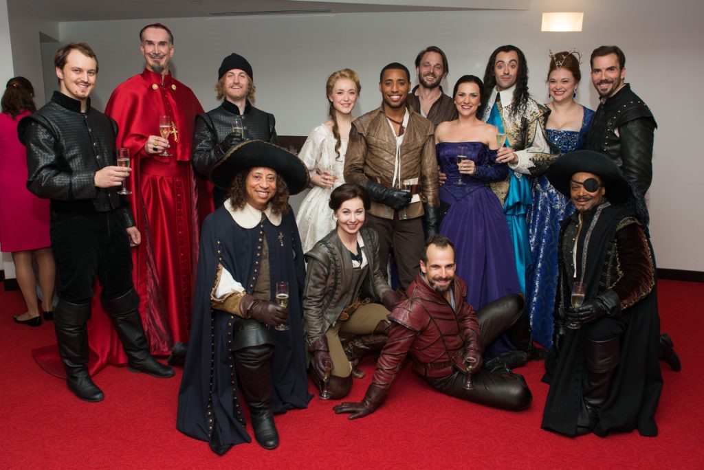 The cast of the Alley Theatre's The Three Muskateers joins in post-performance champagne toasts. (Photo by Jacob Power)