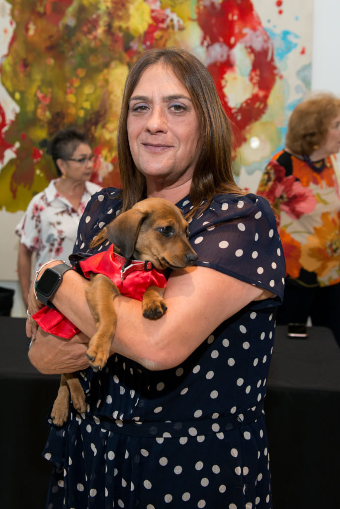 Sandi Mercado with rescue dog Tootsie (Photo by Jacob Power)