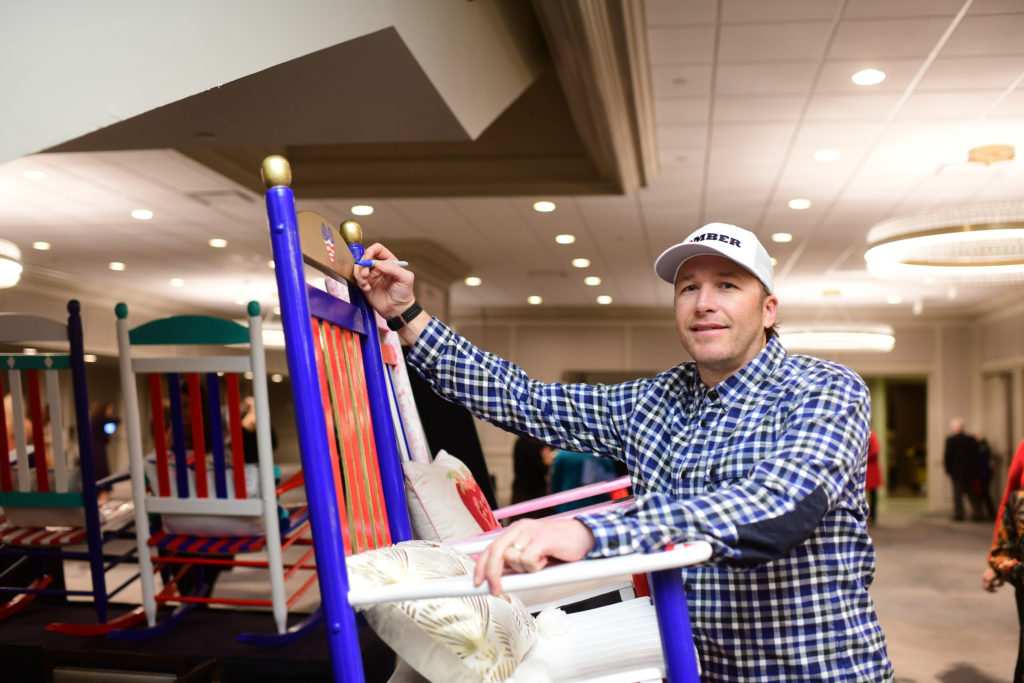Bode Miller signing rocking chairs photo by Daniel Ortiz