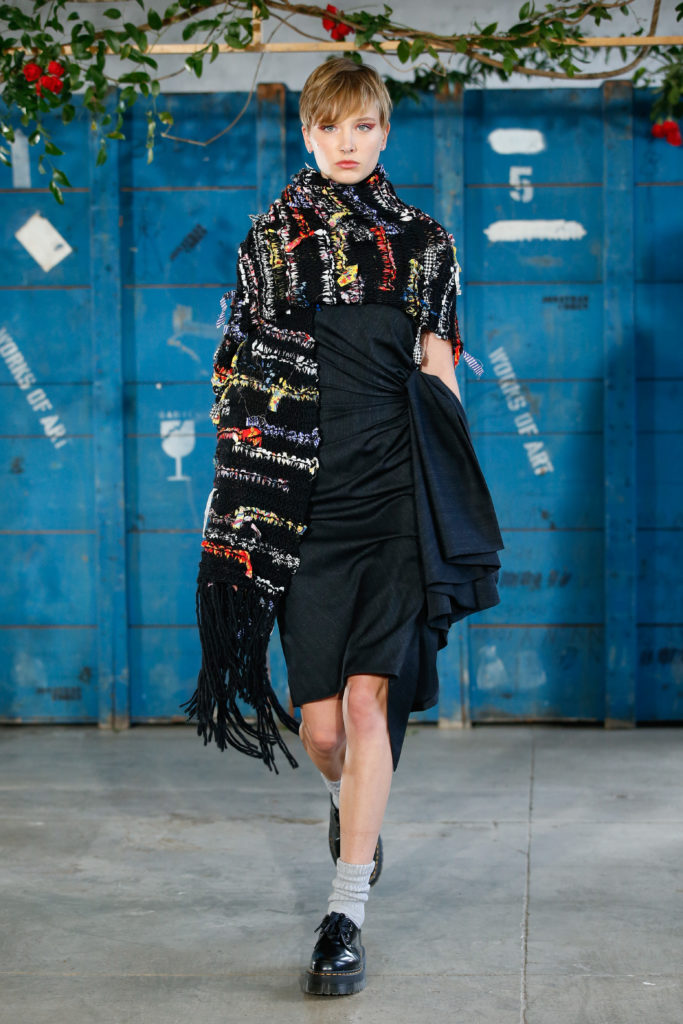 Jonathan Cohen opened his runway show with a black dress gathered at the waist and scarf made from recycled Italian cashmere. (Photo by Dan Lecca)
