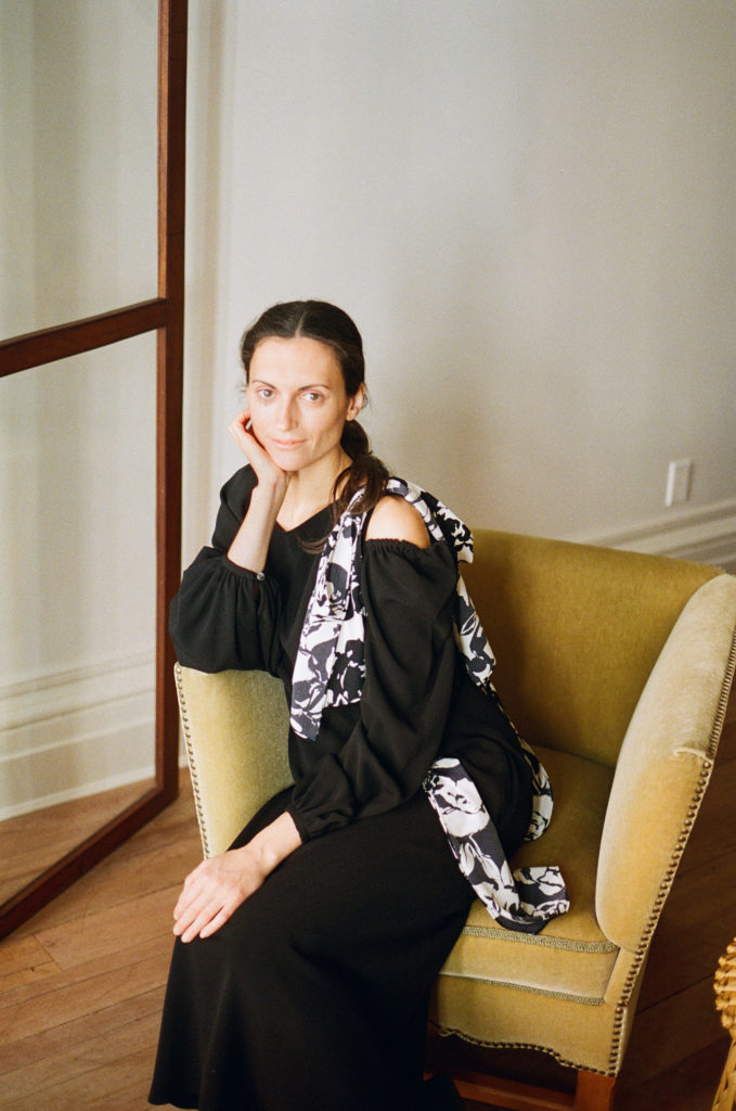 Rentrayage black dress with floral scarf made from repurposed material. (Photo courtesy of Rentrayage)