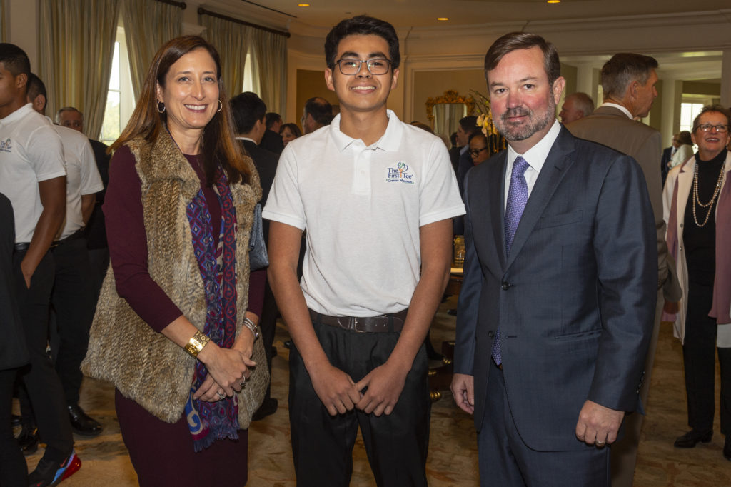 Jessica Chisolm, First Tee participant Miguel Espinoza, Rob Chisolm (Photo by Hugh Hargrave)