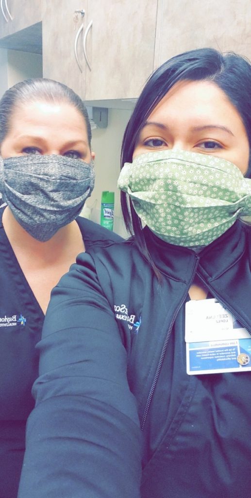 Hospital workers wearing masks made by refugees