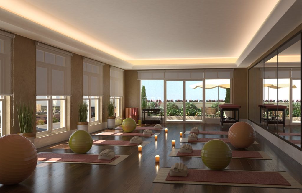 Move your body and mind in the residents-only yoga studio featuring a mirror wall, smart TV for at-home app-workouts and movable barres for barre classes. 