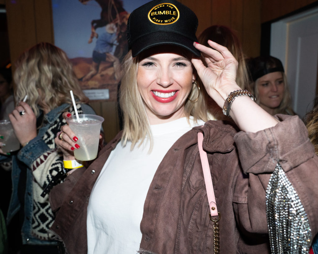 City Boots founder Lizzy Bentley showing off Bumble x Ray's Bar merch. (Photo courtesy of Chandler Allen/BFA.com)