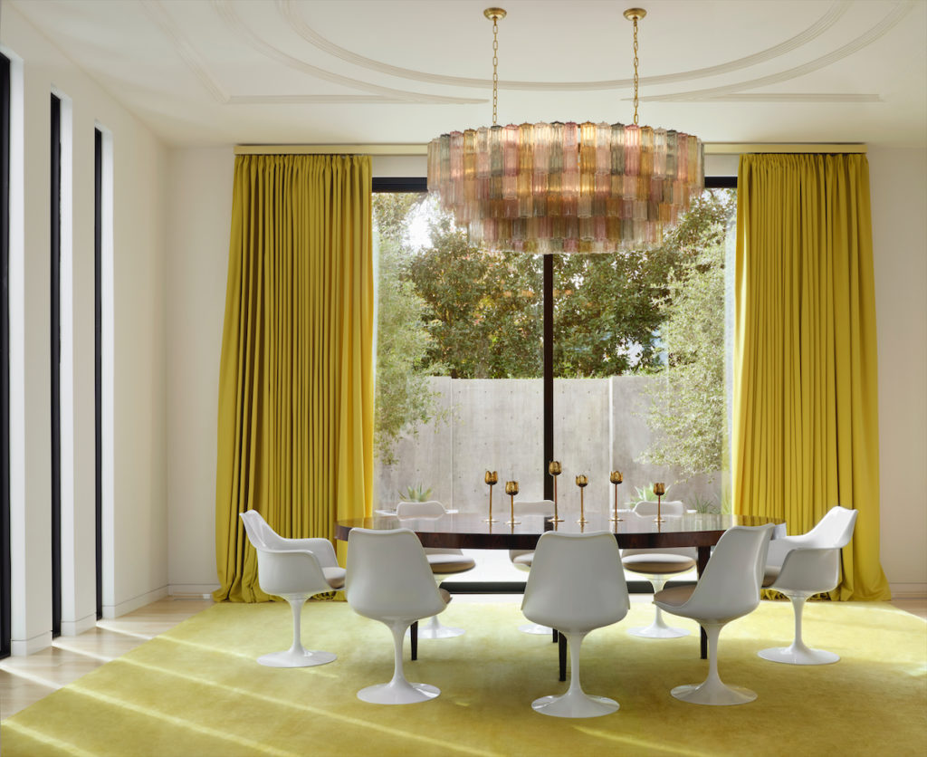 The dining room's Brazilian rosewood table custom made by Keith Fritz through George Cameron Nash. Eero Saarinen chairs from Knoll. Custom rug from The Rug Company. Murano 1970s chandelier from France. Julie Hayes and architect Weldon Turner collaborated on the plaster ceiling design. (Photo by Lisa Petrole)