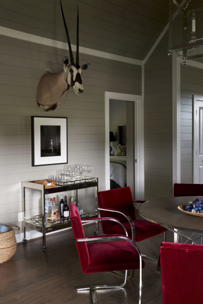 A set of six Mies van der Rohe Brno chairs in their original mohair formed the basis of a modern look and palette in one of the bungalows. Photograph and taxidermy are from Cone and Fourticq's personal collections. (Photo by Pär Bengtsson)