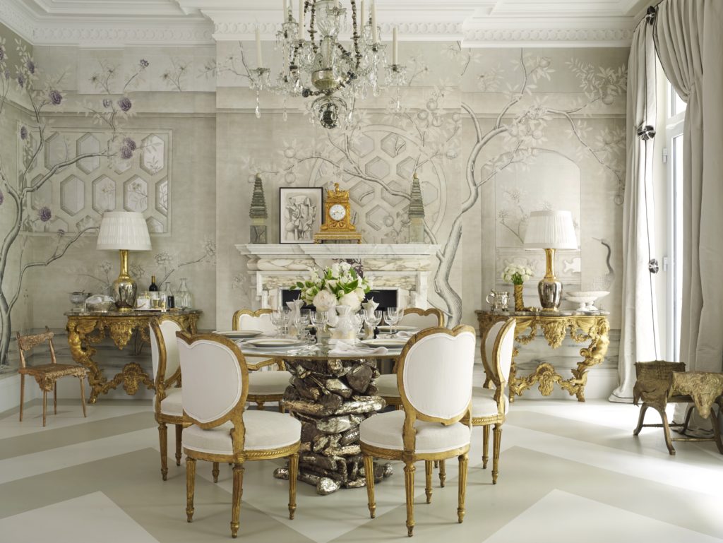 A hand-painted grisaille wallcovering by Gracie wraps the lofty multipurpose space in the 2016 Kips Bay Decorator Show House designed by Alex Papachristidis. (Photo by Tria Giovan)