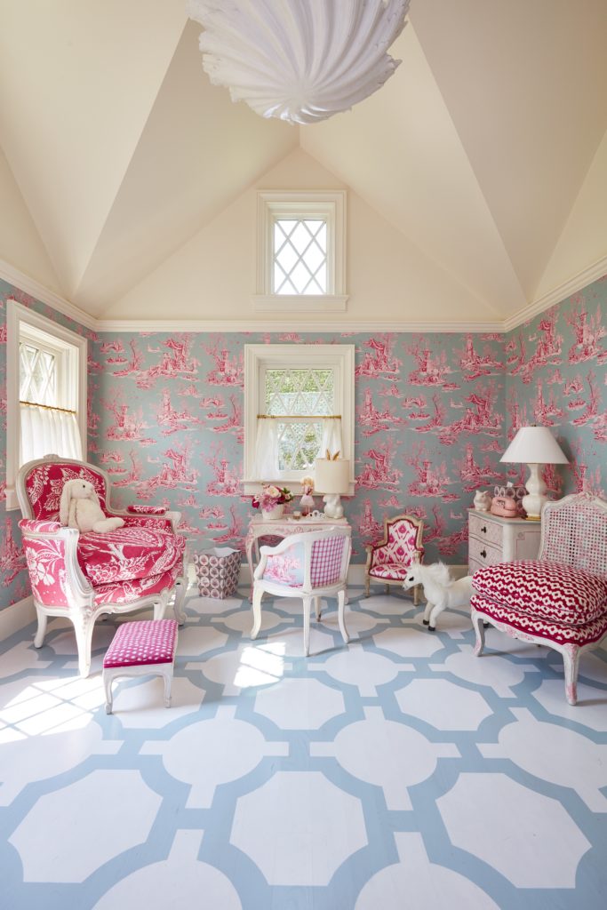 In a Long Island playhouse designed by Alex Papachristidis, Manuel Canovas toile wallpaper lines the walls of the vaulted interior, where the floor was painted by Boxton Design Group in homage to a floor painted by decorative artist Graham Carr for Pauline de Rothschild in the 1970s. (Photo by Thomas Loof)