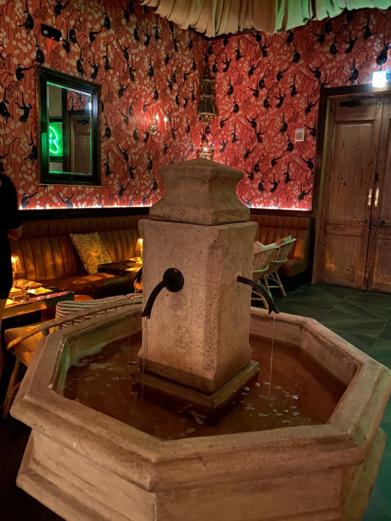 Guests are invited to fill their cups at the rum fountain that flows continually in the center of the intimate club. (Photo by Shelby Hodge)