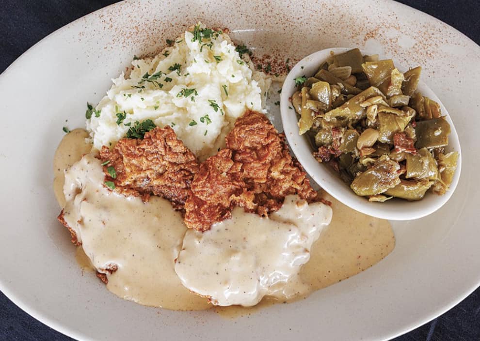 The decadent chicken fried steak at Michael's Cuisine along West 7th Street.