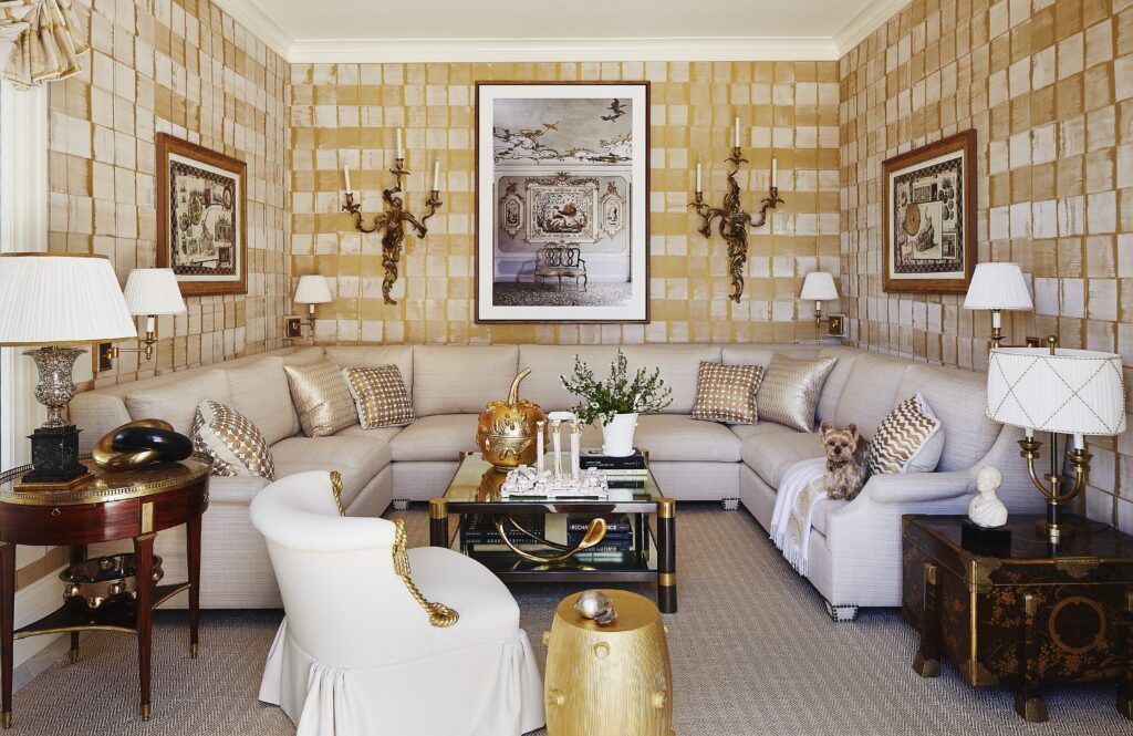 In a Bridgehampton beachside home, 
Anya Larkin hammered silk sheathes the sitting room, with photograph by Jean François Jaussaud. The Beauvais carpet is made of woven metallic leather. (Photo by William Abramowicz)