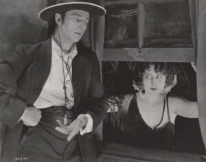 Amon – Karl Struss Collection – Theodore Kosloff beckoning Dorothy Dalton through open window, Fool’s Paradise.