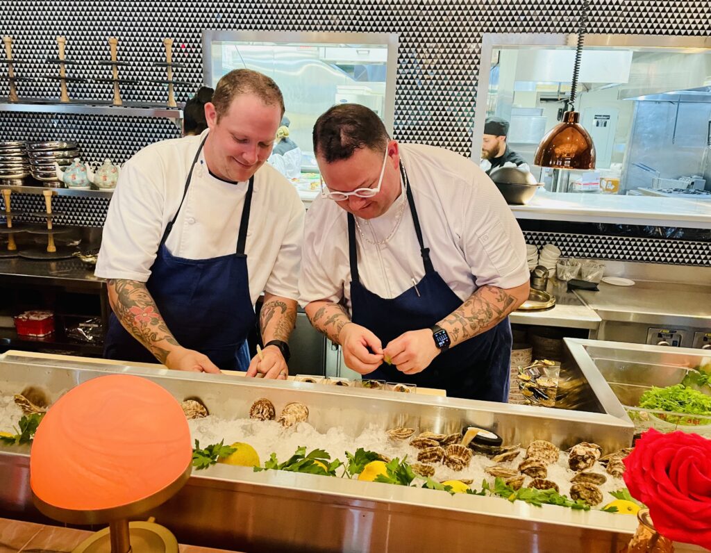 Graham Elliot working on the oyster course at Saturday's launch party. (Photo by Courtney Dabney)