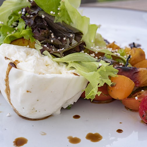 Quince's torched peach summer salad is a refreshing Fort Worth restaurant option.