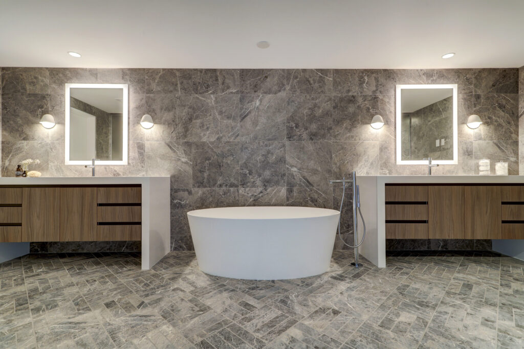 The downstairs primary bathroom is also a relaxing oasis.