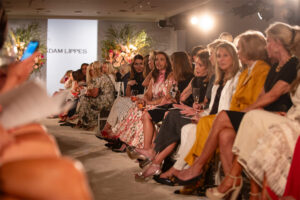 Guests line the runway in anticipation