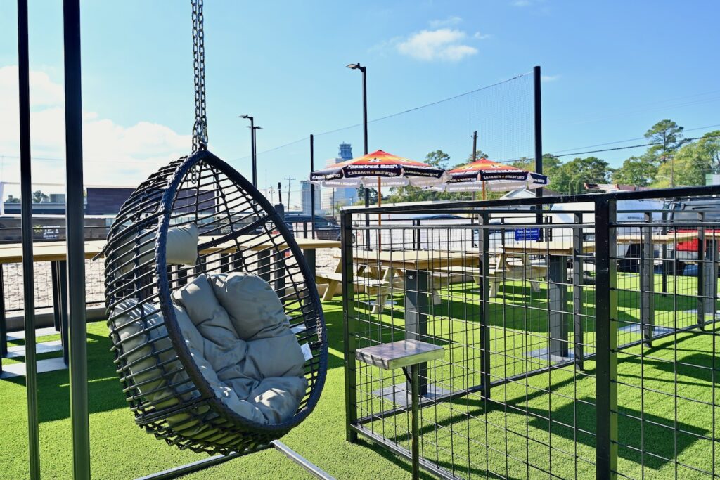 Outside, a vast green space adjoins the sand volleyball courts at The Decoy. (Photo by Alex Montoya)