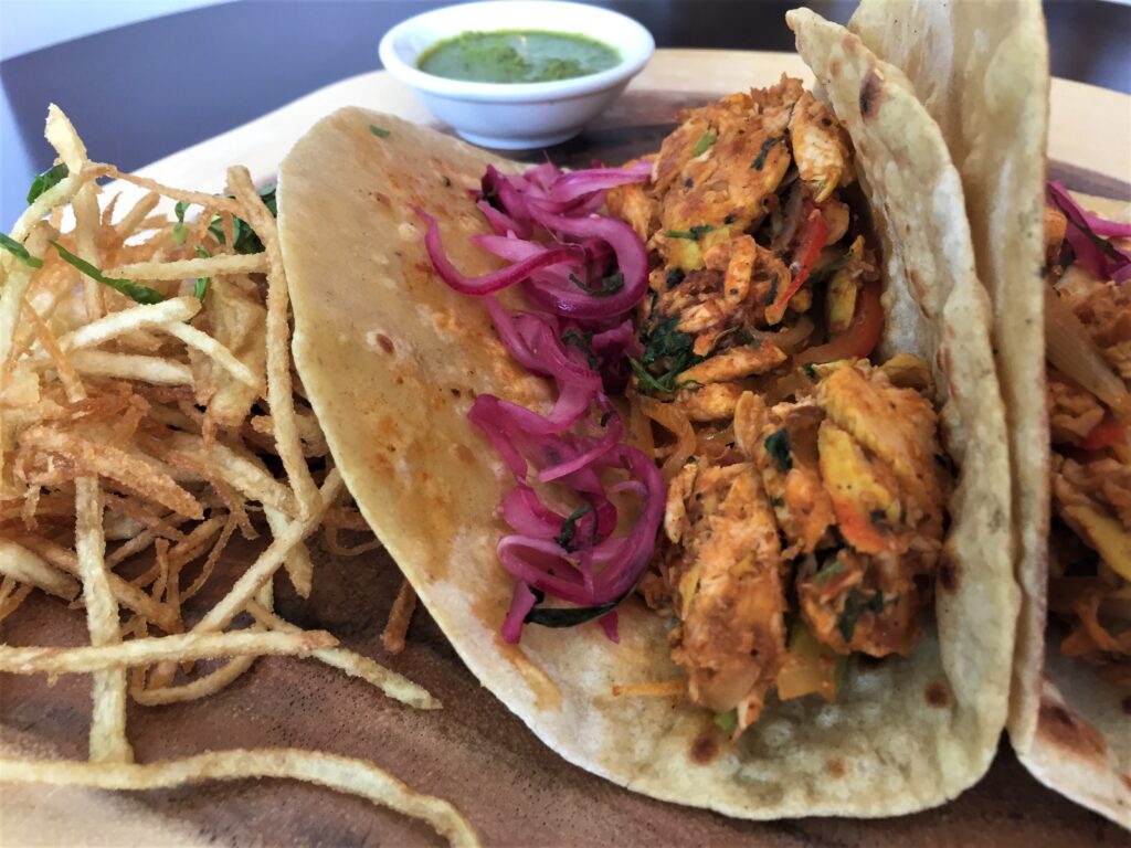 Spice Zest's menu includes Calcutta Chicken Tikka Kathi Rolls ($14.95) created with pulled tandoori chicken, tossed with onion and spices , desi fries with sumac. (Photo by Sunil Srivastava )