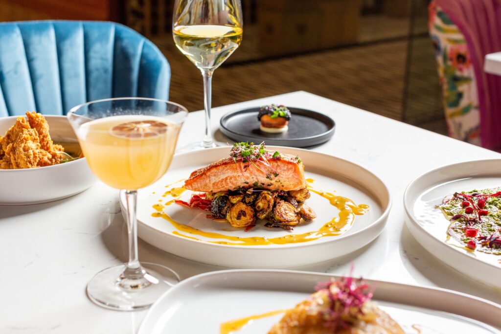 An array of dishes including an Ora King salmon was created by talented consulting chef Bryan Caswel for PostScript. (Photo by Jenn Duncan)