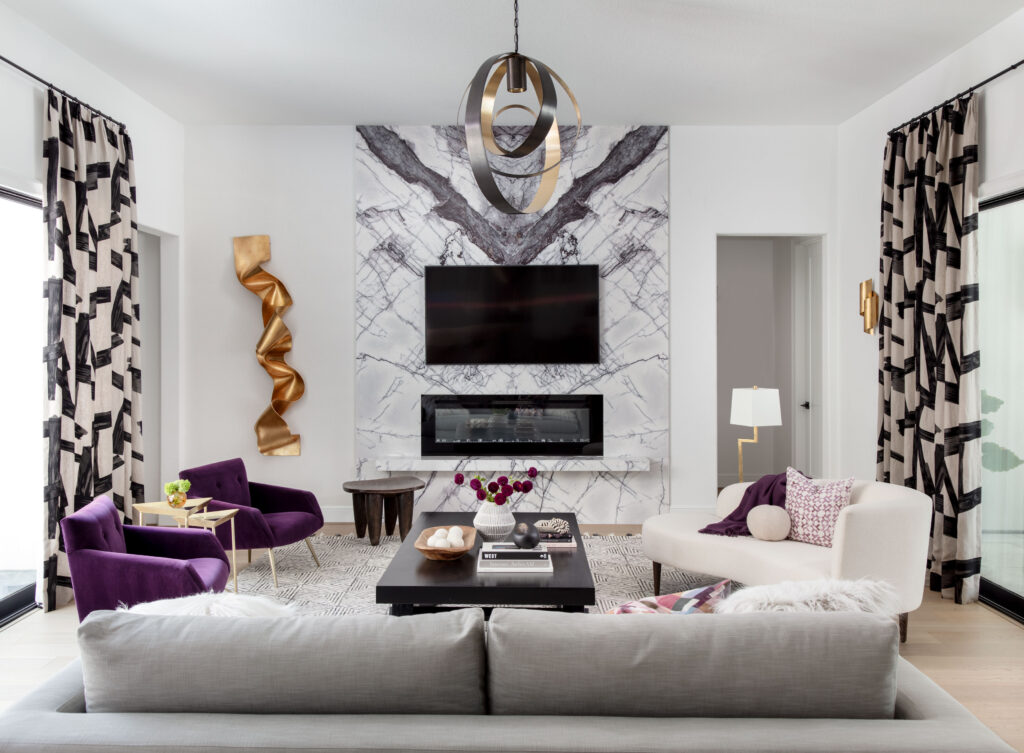 A vibrant pop of purple keeps the living room colorful in the Toll Brother's home in Woodson's Reserve.