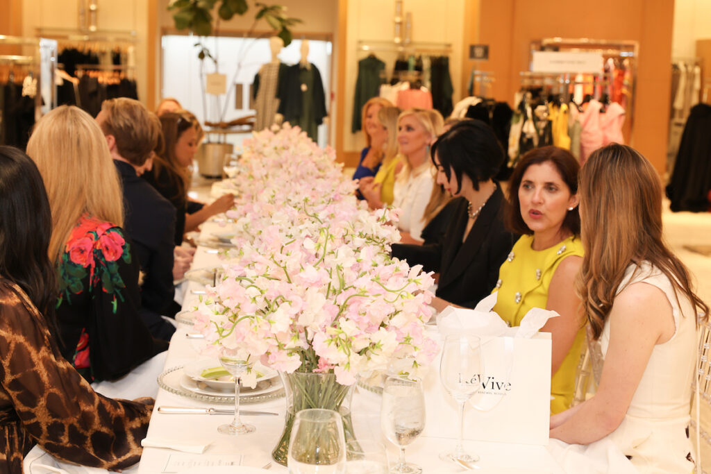 Sweet peas, designer Adam Lippes' favorite flower, line the luncheon table at Neiman Marcus. (Photo by Priscilla Dickson)