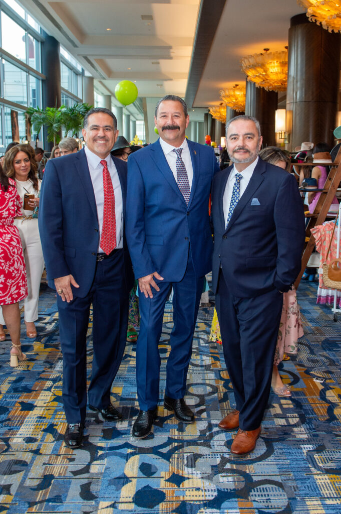 Juan Garcia, Thomas Lewis, Joaquin Jimenez at the Latin Women's Initiative fashion show and luncheon. (Photo by Jacob Power)