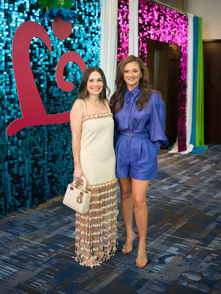 Michele Leal, Maritza Gonzales at the Latin Women's Initiative fashion show and luncheon. (Photo by Daniel Ortiz)