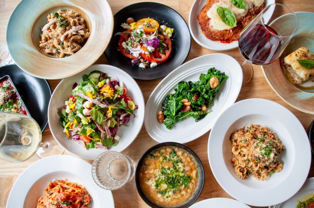 Serving as the focal point of the restaurant, the wood-fired grill fires up many of the meat and vegetable dishes. (Photo by Mia Valdez)