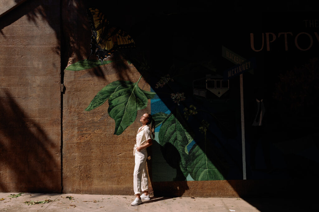 Brooker's concept breaks outside the bounds of a simple square mural and flows organically through the space, as if the flowers are growing and overtaking the underpass wall and bridge. (Photo by Meda Abigail Photography)