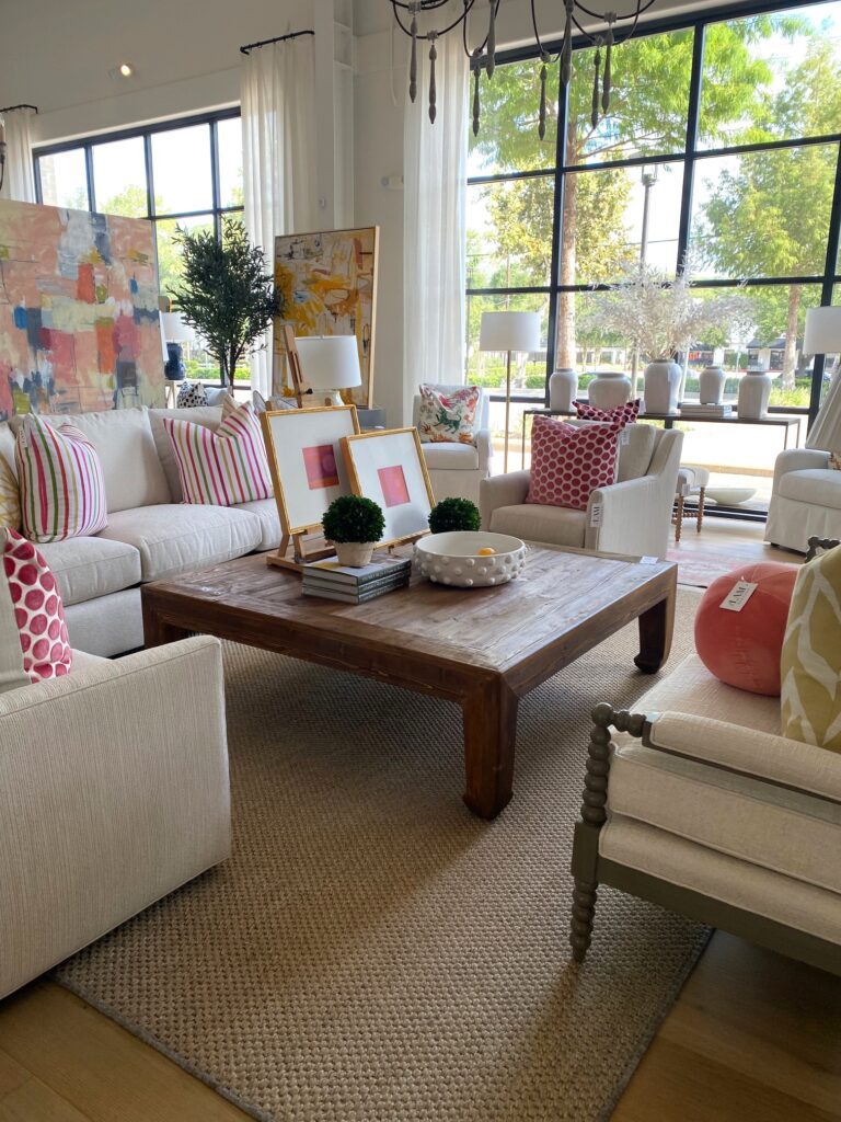 LAM's neutral furniture color palette is punctuated with color in pillow, art and artwork in the bright, airy showroom. (Photo by Laura Landsbaum)