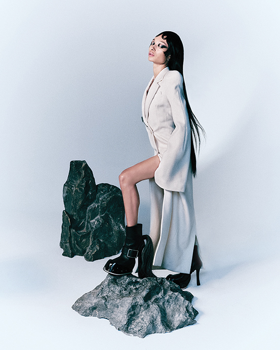 Alexander McQueen by Sean McGirr double-breasted coat $4,800, brooch $590, and hoof boot $3,390, at Alexander McQueen Highland Park Village, Neiman Marcus, Tootsies, farfetche.com, net-a-porter.com.  (Photo by Enmi Yang)