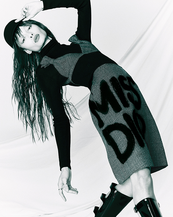 Dior bra with Miss Dior bows $2,000, Miss Dior graffiti-pattern skirt $3,000, turtleneck sweater $1,800, city cap $890, D-idole boot $2,490, and D-Pépite ring $380, at Dior Highland Park Village.  (Photo by Enmi Yang)