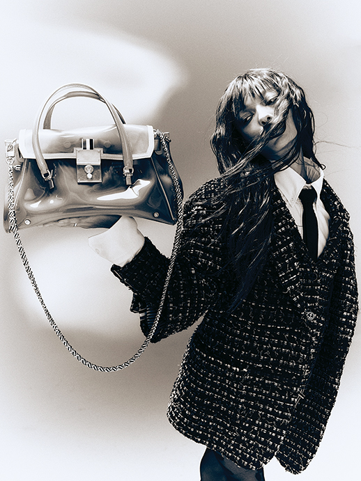 Thom Browne overcoat, patch-pocket jacket, and mini-skirt, all in black denim ribbon tweed; Oxford button-down shirt $490; twill necktie $190; and Mr. Thom luggage bags with removable rain slicker, at Forty Five Ten, Neiman Marcus, farfetch.com, modaoperandi.com, net-a-porter.com.  (Photo by Enmi Yang)