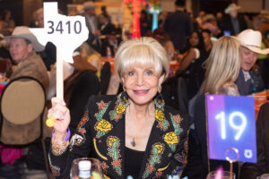 Bidding for a cause Leisa Holland Nelson Bowman photo by Wilson PArrish