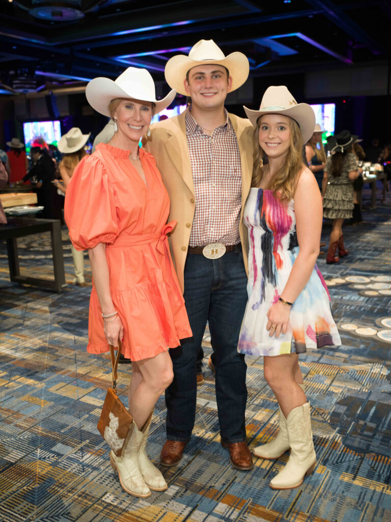 Heather Holmes, Ethan Holmes, Mary Stone at the Houston Cattle Baron's Ball. (Photo by Daniel Ortiz)