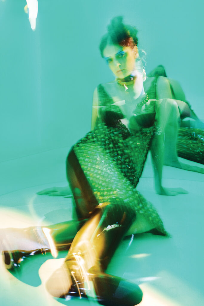 Gucci lace-and-velvet midi dress $13,000, chiffon silk culotte $720, silk ribbon $520, stud choker $2,950, and leather boot $2,500, at select Gucci boutiques, farfetch.com, net-a-porter.com.  (Photo by Fernando Rodriguez)