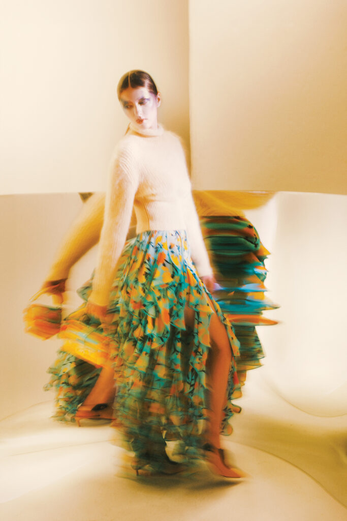 Louis Vuitton brusher mohair pullover $1,840, carnation-print skirt $7,950, petite Malle bag $8,650, and slingback pump $1,200, at select Louis Vuitton boutiques, 866.VUITTON, louisvuitton.com. (Photo by Fernando Rodriguez)