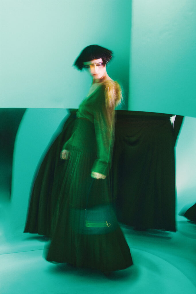 Burberry shearling trim sweater $1,550, wool mohair kilt $3,490, boot $2,090, and Rocking Horse bag 2,890, at the Burberry boutique, Neiman Marcus, net-a-porter.com, farfetch.com.  (Photo by Fernando Rodriguez)