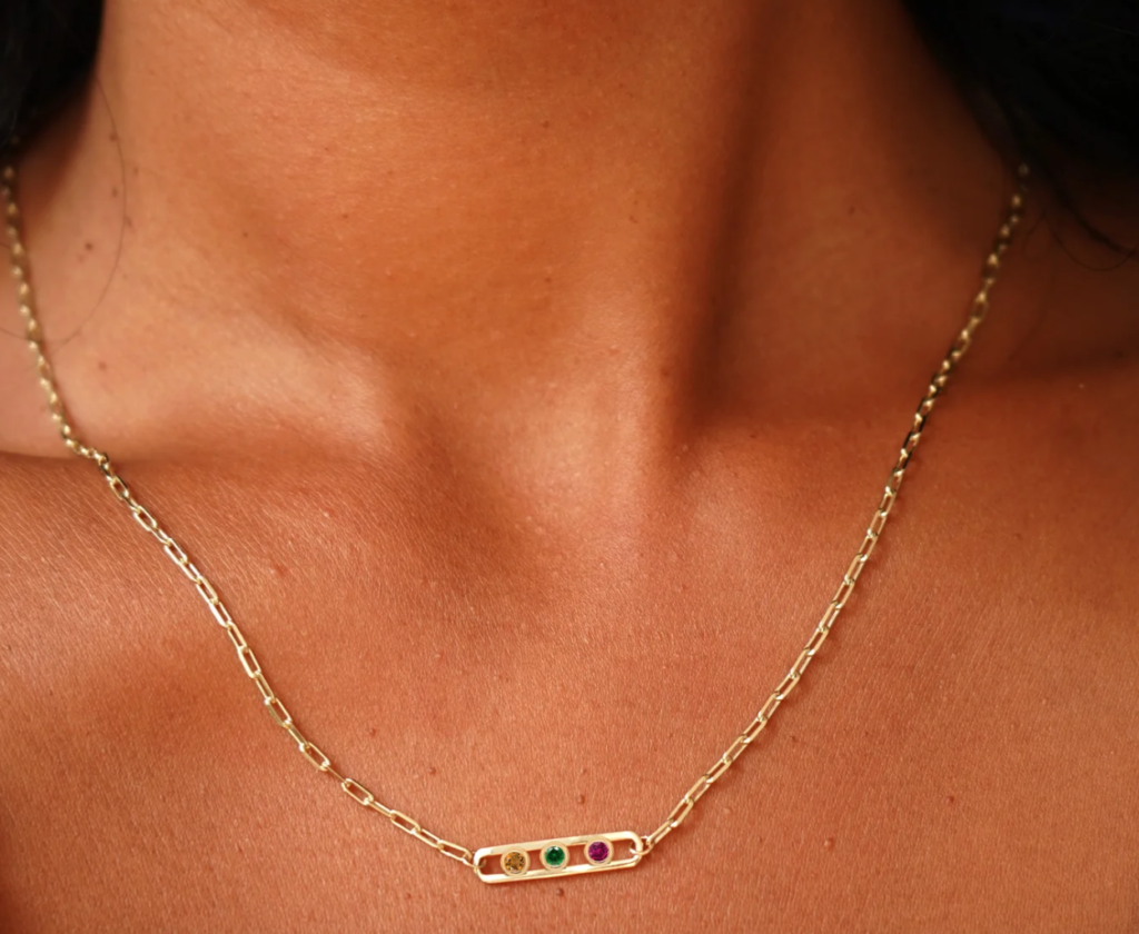 The Dancing Gemstone Necklace features recycled gold and a customizable gemstone charm that moves for added elegance. (Photo courtesy Automic Gold)