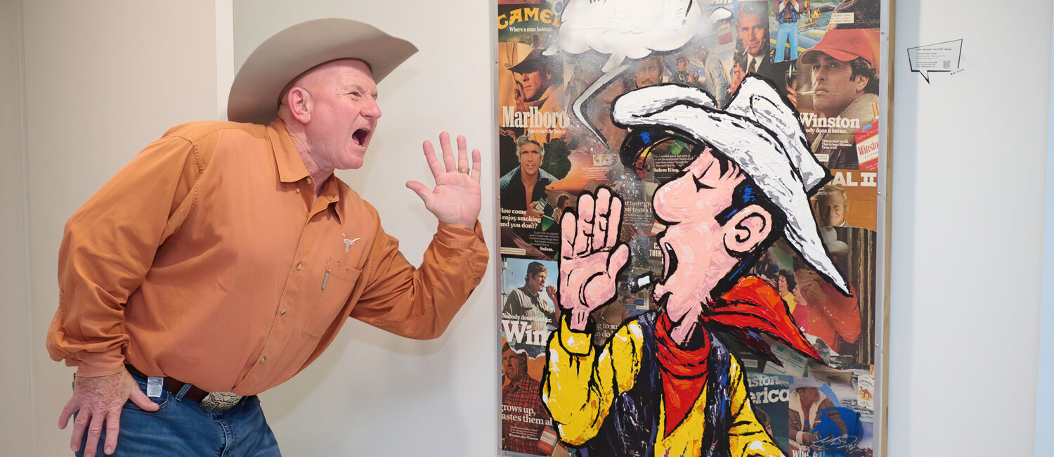 Jacques Fox gets into the “Frenchies & Friends” opening celebration at Alliance Française de Houston. (Photo by Charlie Horse Photography)
