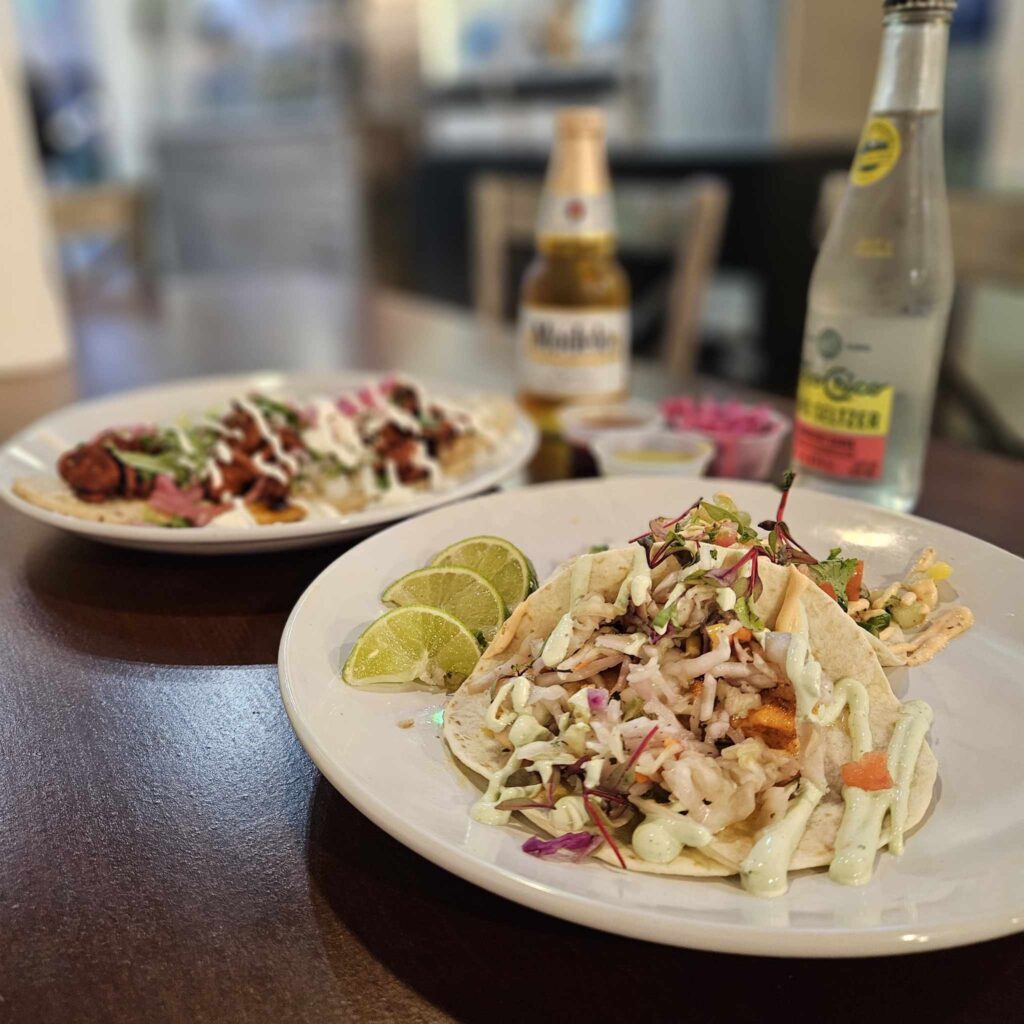 Seafood tacos shine at Los Guapos Mexican Street Food, offering fresh shrimp, octopus, and fish alongside creative dishes like birria ramen and the Cali burrito. (Photo by Edward Brown)
