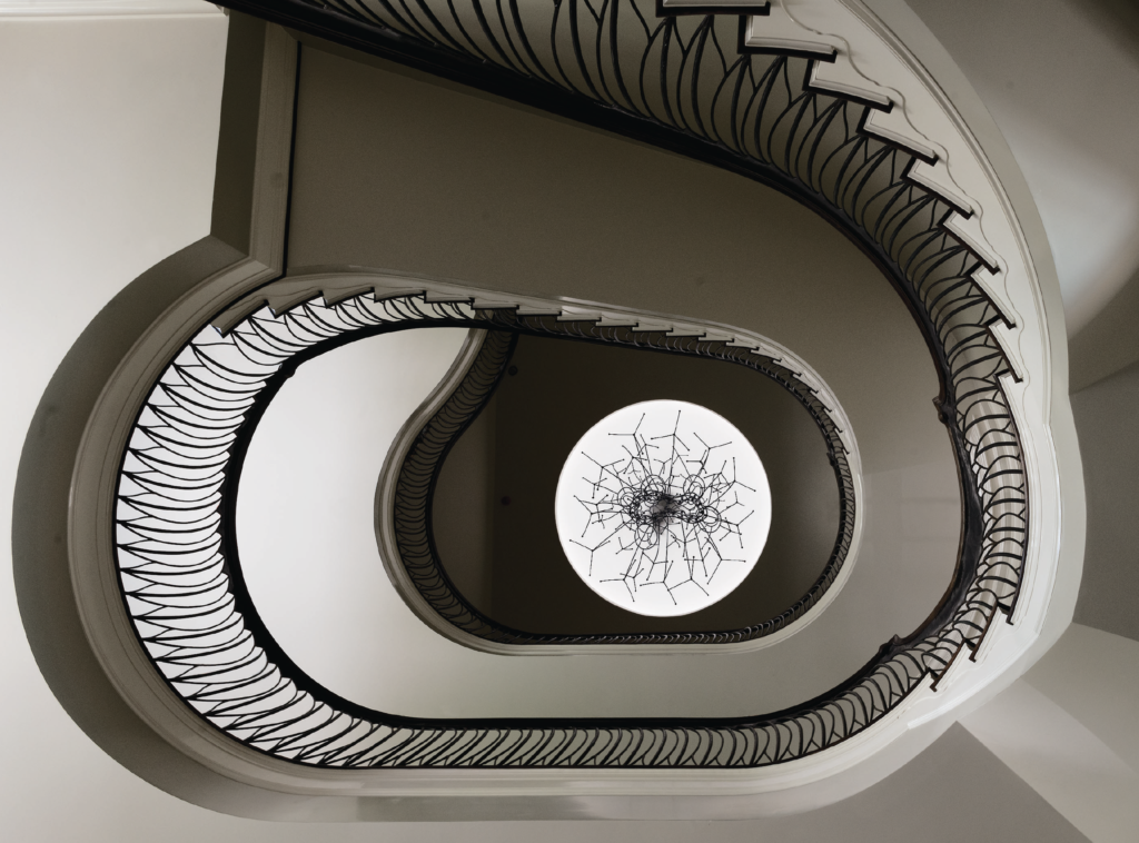 In Marilyn Oshman house, soaring stairs boast the sculptural expertise of Ed Wilson’s organic metal rails and James Surls' dome, which both figuratively and literally mark and apex of the collection. (Photo by Jack Thompson)