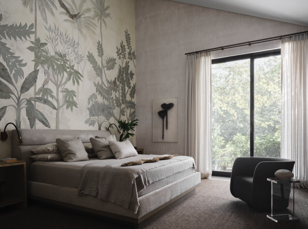 A mural in the main bedroom is by Priscila Gonzalez Urrea. Baker Furniture bed, Peacock Alley bed linens. Framed antique brooms from Karakanagues New York Antiques and Collectibles. Chair by Bright Chair, Allan Knight table.
(Photo by Douglas Friedman)