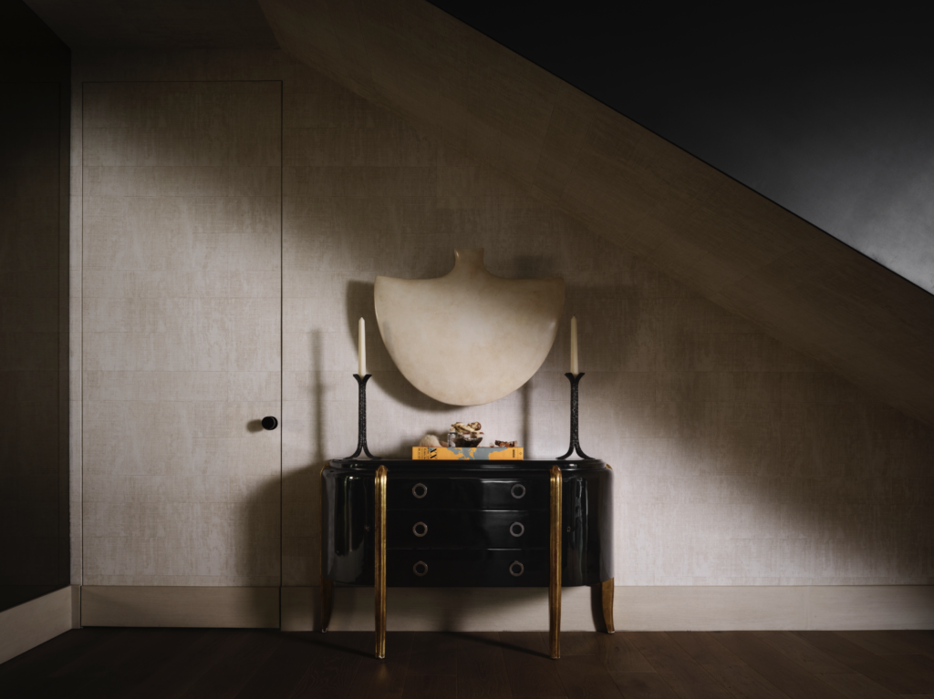 Ebony console from Jean de Merry, bronze Ingrid Donat candle holders from Carpenters Workshop Gallery, Paris. Wall art by Xawery Wolski. Élitis wallcovering from George Cameron Nash. (Photo by Douglas Friedman)