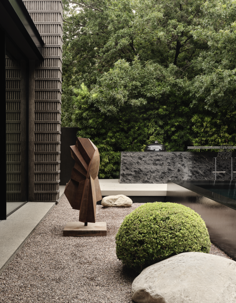 Sculpture by Austrian artist Gerda Gruber. Ancient Aztec stelae inspired the pattern for the exterior’s carved Mexican limestone. (Photo by Douglas Friedman)