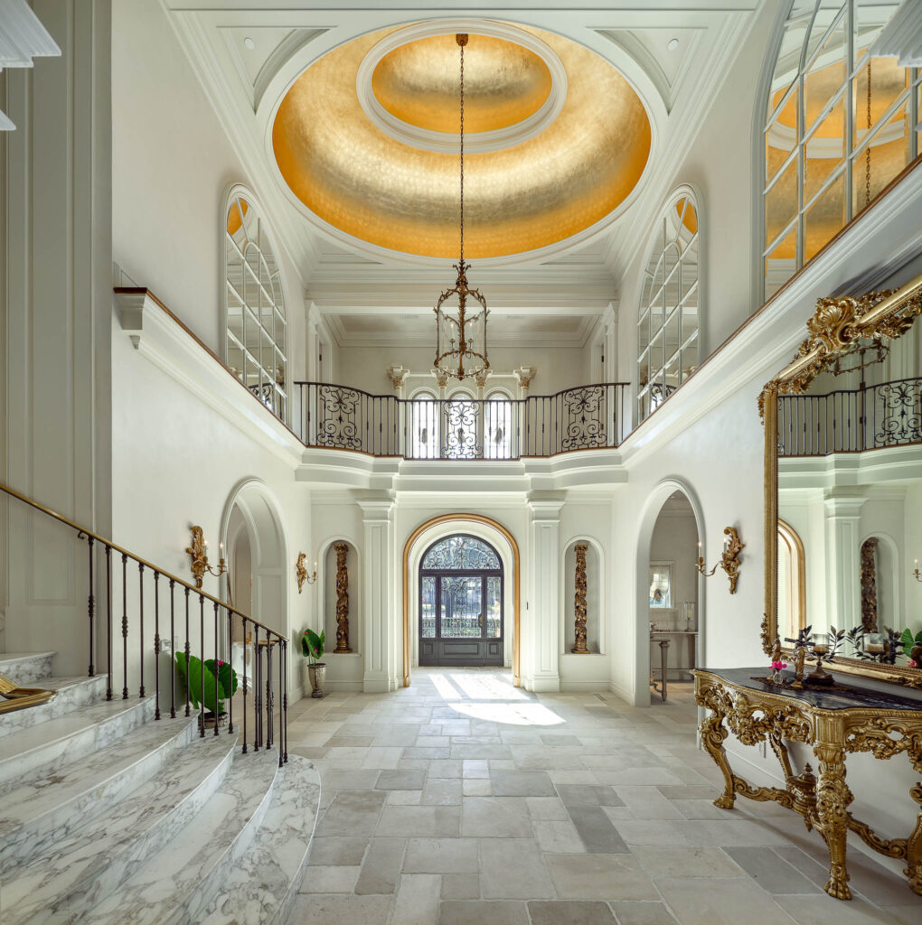The soaring ceilings of the grand foyer highlight a ceiling dome adorned with 24-karat gold leaf. (Photo by Briggs Freeman Sotheby's International Realty)