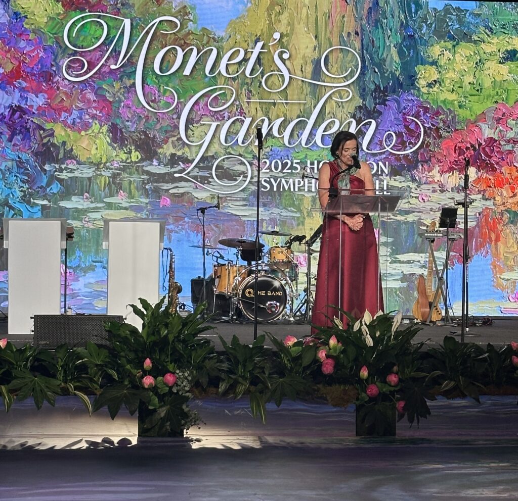 Houston Symphony board president Barbara Berger on stage where the Monet backdrop is stunning. (Photo by Shelby Hodge)