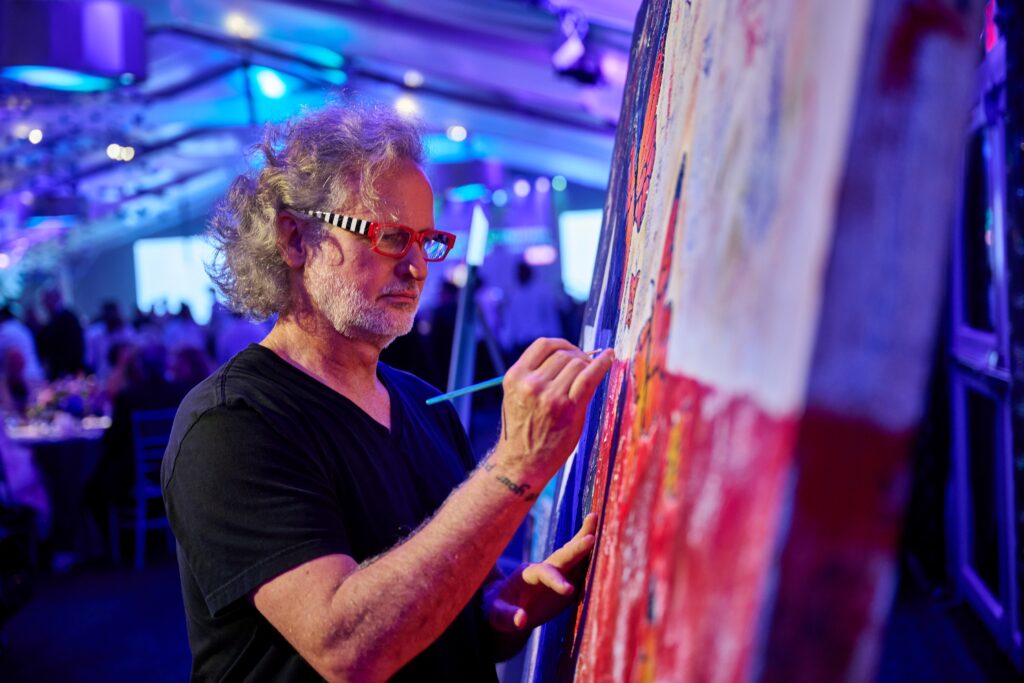 Artist Taft McWhorter creates a work of art  in the auction at the Discovery Green Gala (Photo by Fulton Davenport)