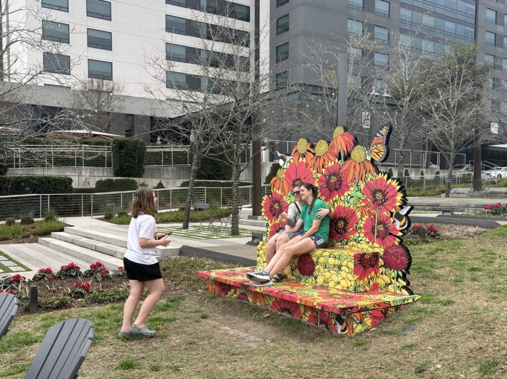 The benches surround visitors, creating the illusion of floating on a cloud of flowers at City Place through April, and again in June and July. (Photo by Laura Landsbaum)